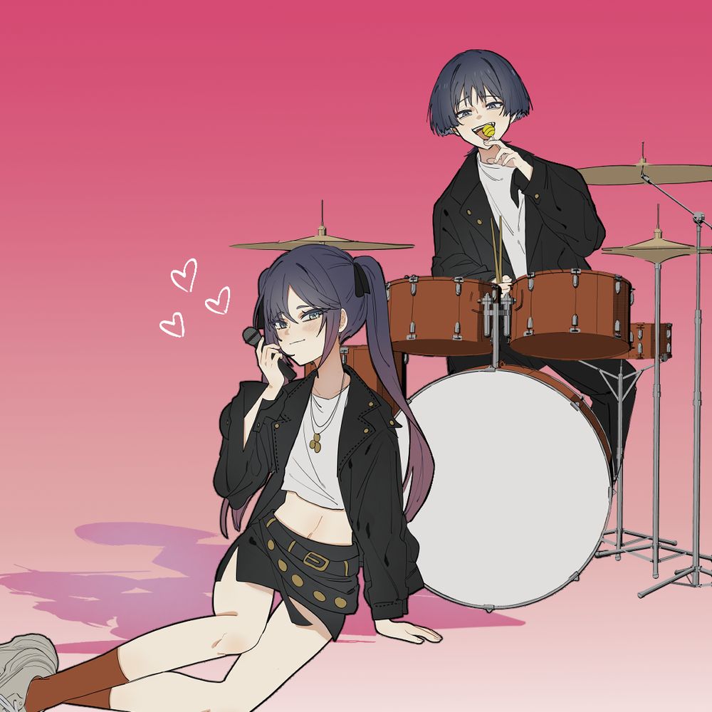 Scaramouche sitting at the drums eating a lollipop. Mona sitting in front with a microphone.