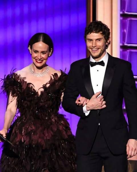 a photo of sarah paulson and evan peters presenting at the 77th Primetime Emmy Awards.