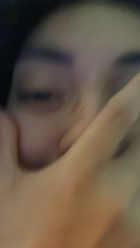 Jonna-Lynn Alonso holding a hand to her face.