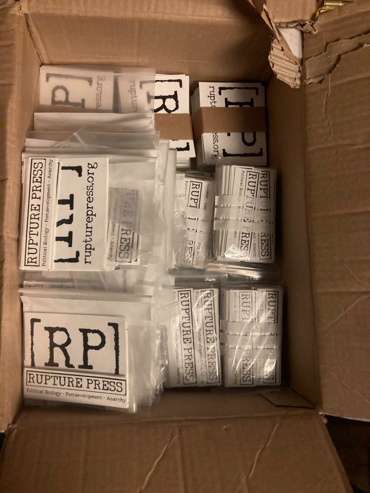 80 packets w/ 10 little stickers & 6 big #RupturePress stickers & big stacks of much more. All the stickers are black and white.