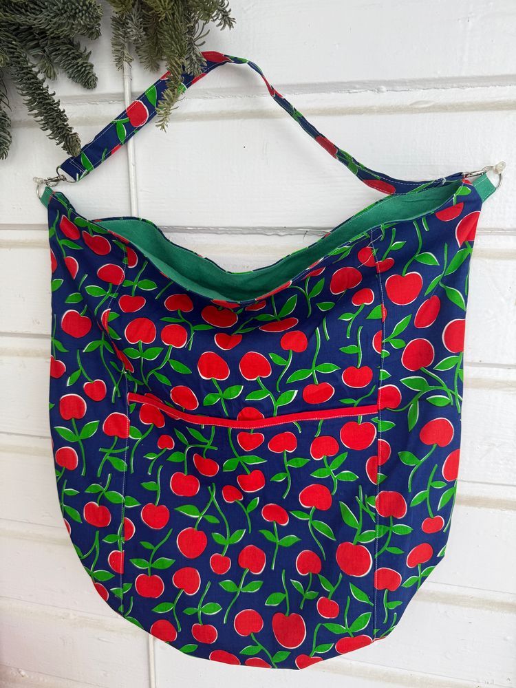 Large tote made with vintage cherry-print fabric and a linen table cloth as the lining.