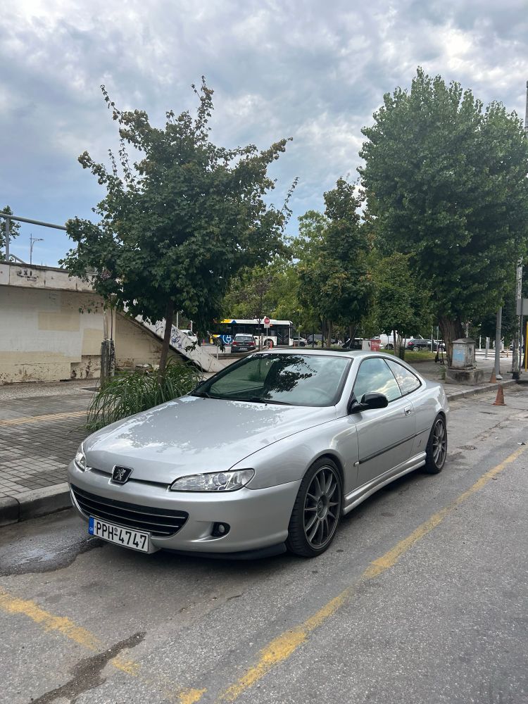 A silver Peugeot 406 Coupé styled by Pininfarina, improved by