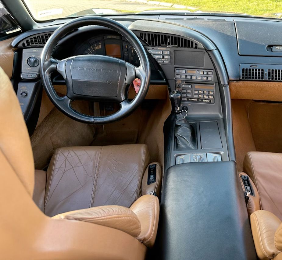 A C4 facelift interior from 1991 on Collecting Cars with a black/tan interior. Notice the layout.