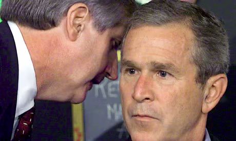 Image of George W Bush being told of the 9/11 attacks
