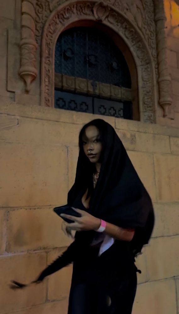 woman standing in front of church