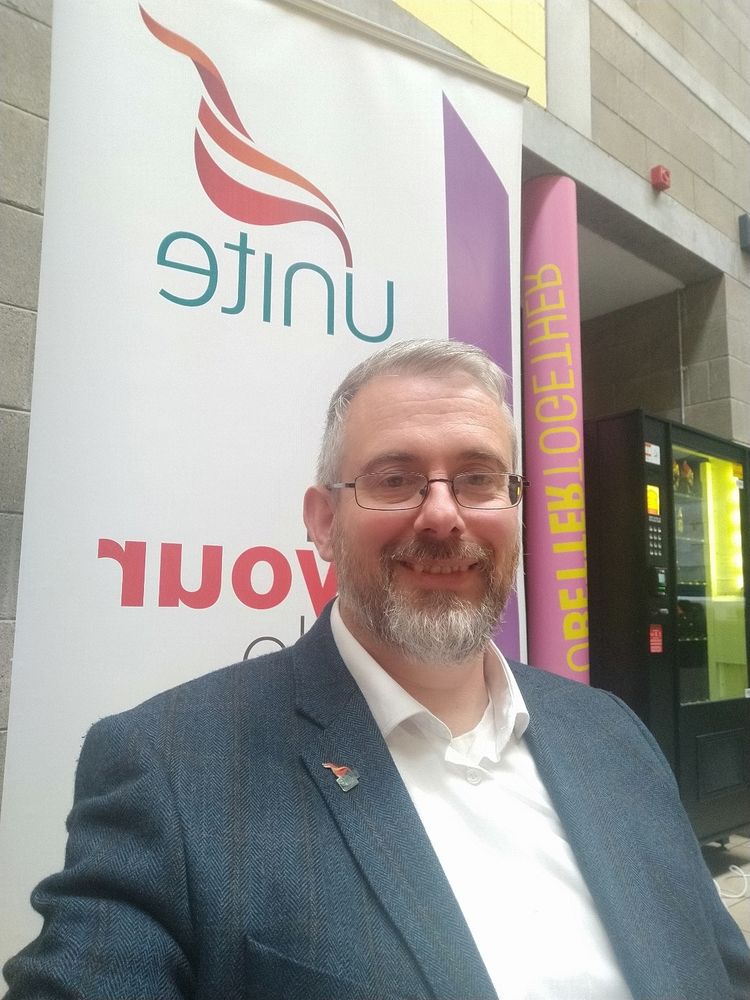 Me again, smiling awkwardly again in front of the banner again