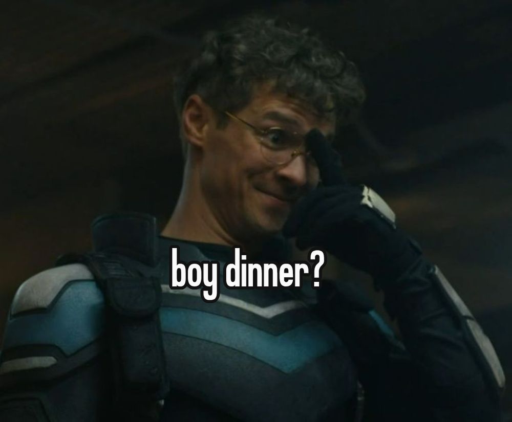 picture of adrian chase pushing up his glasses with white text in front of it with a black outline saying "boy dinner?"