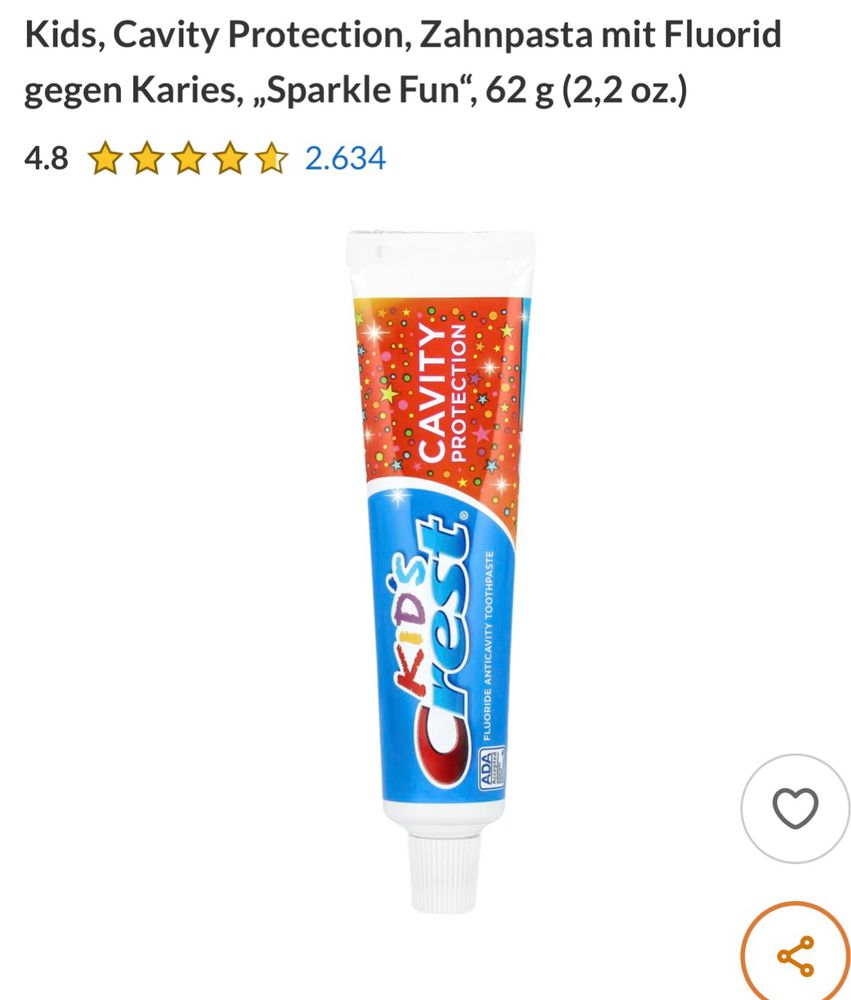 Bild von blau-roter Kinder-Zahnpasta-Tube. Die Pasta enthält Glitzer.
