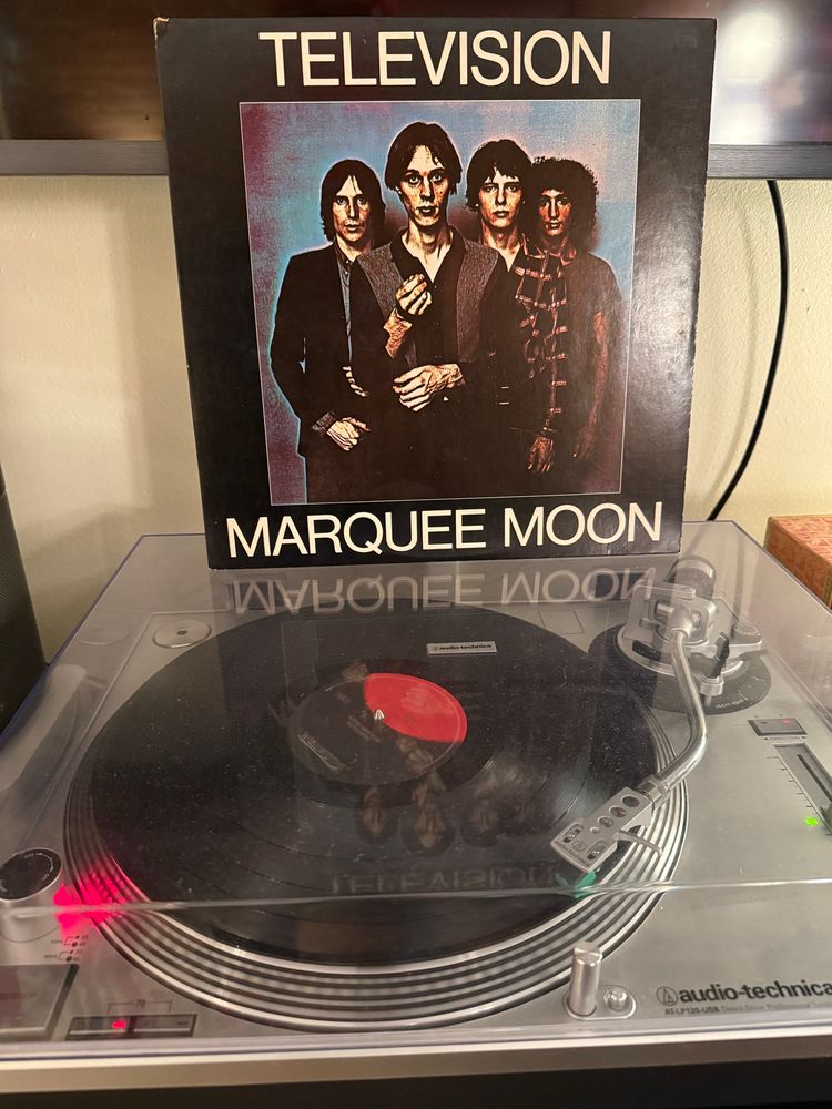 A vinyl copy of Television’s masterful album Marquee Moon spinning on an Audio Technica turntable.