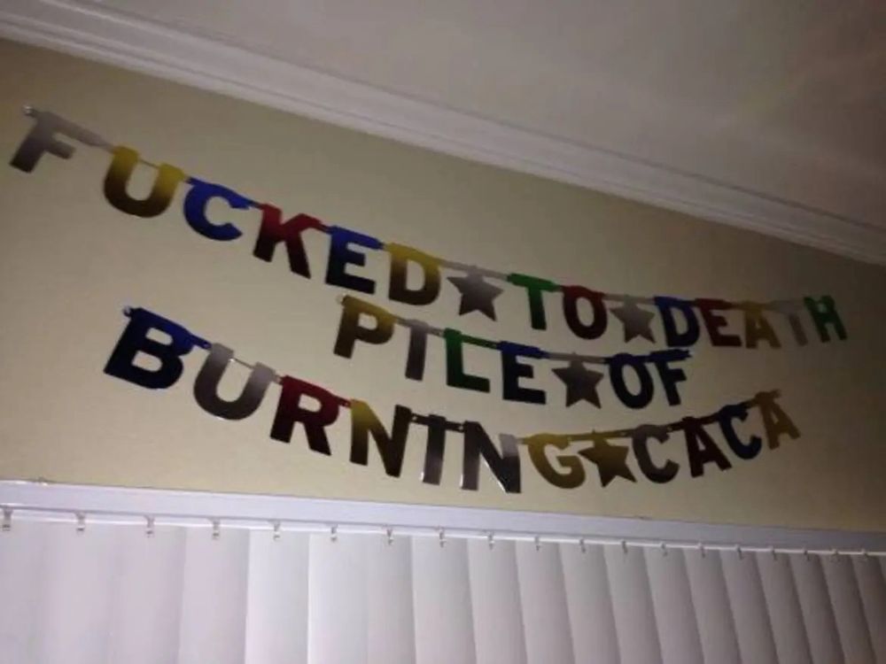 party decorations that say “fucked to death pile of burning caca”
