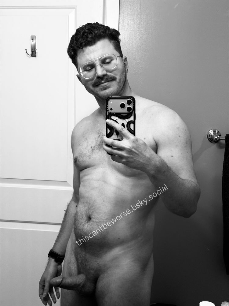 A black and white photo of thiscantbeworse naked with an erection