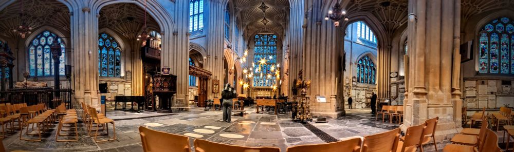 A panorama of Bath Abbey with the altar in the middle of the photo
