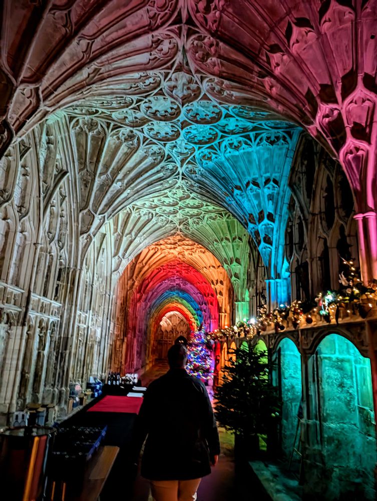 The cloisters of Gloucester Cathedral lit up in rainbow colours 