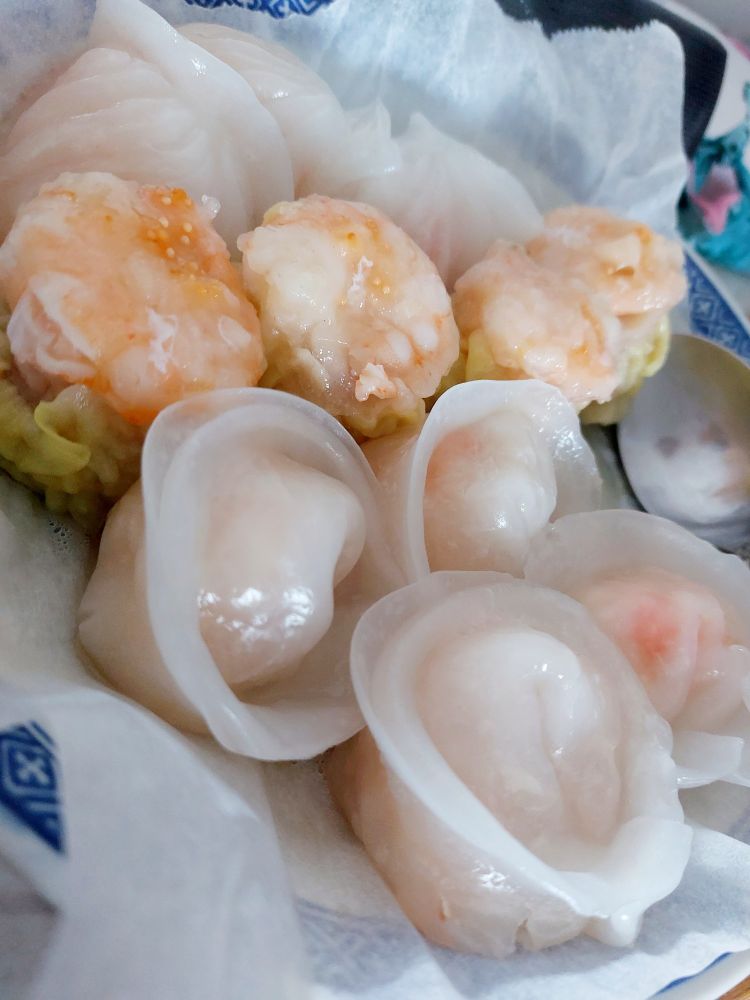 three different kinds of dumplings, two with shrimp, one with pork & topped with shrimp