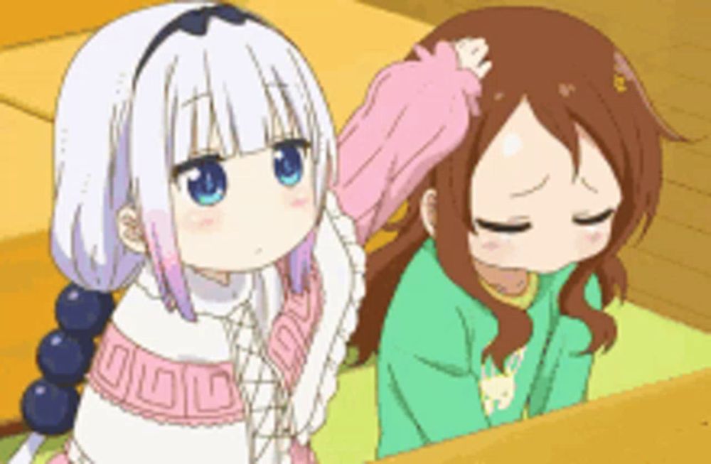 two anime girls are standing next to each other and one of them is petting the other 's head .