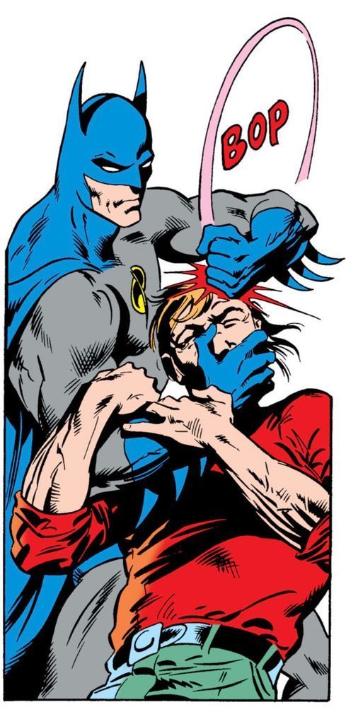 With an all white background image of Batman pulling a man backward with his hand over the guy’s mouth and the other arm swings his fist on the top of the guy’s head. Sound effect: “BOP.“
