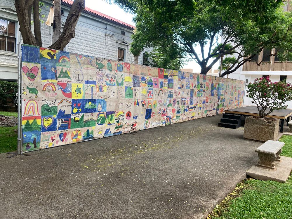 Maui children’s artwork displayed on a fence at Kalana o Maui, Wailuku, Hawai’i, USA, on Aug. 8, 2025. Messages include: “Maui can get through anything.”
“We love Maui!!!” “We will adapt.” “Maui Strong.” “Lahaina Strong.”