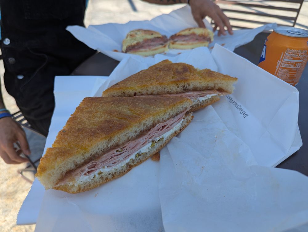 Focaccia sandwich with mortadella, stracciatella, pear jam and crushed pistachios 