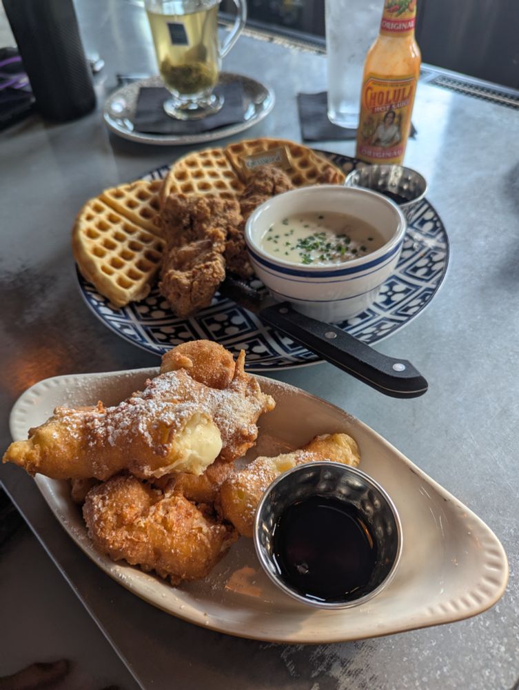 Pancake battered cheese curds and chicken and waffles