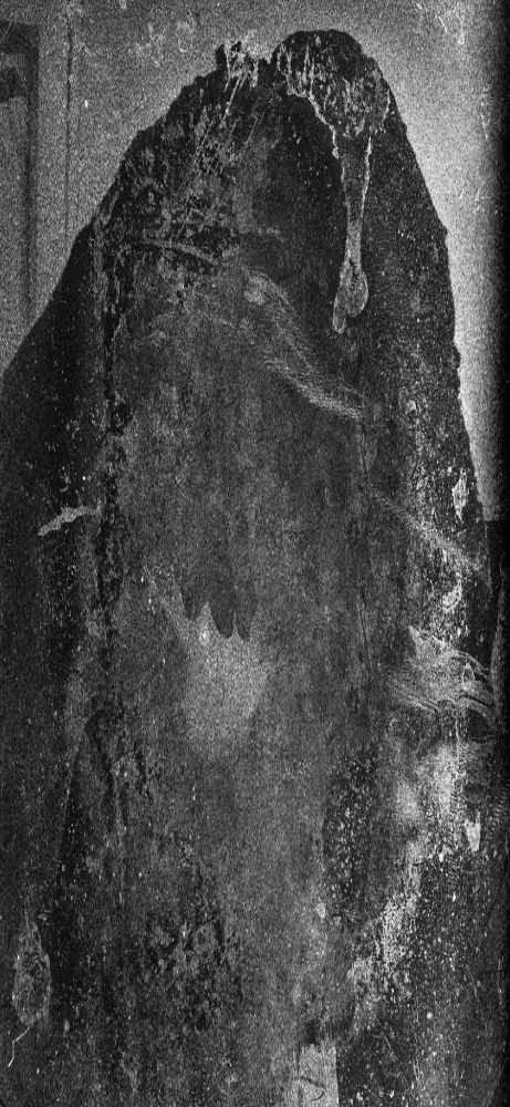 A hooded figure stands in the foreground. The image is too scratched, faded, and damaged to make out much more. 