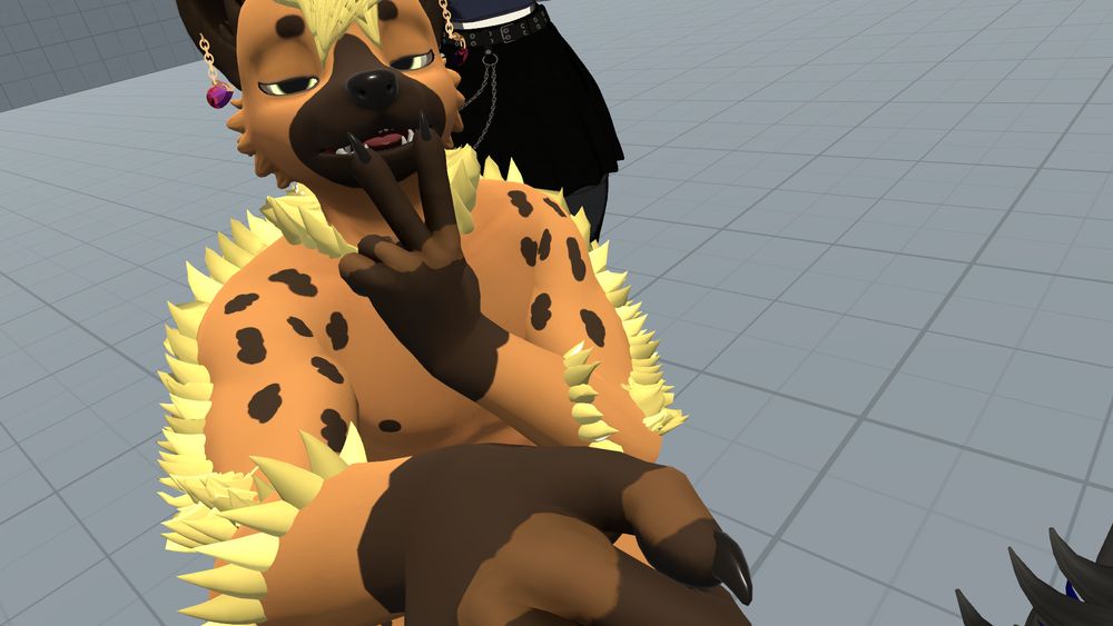 A screenshot of me in PCVR VRChat with my hyena avatar - fully nude but nothing funny showing, with pink sapphire crystals on rose cold chains as earrings/ I am making a V with my fingers and sticking my tongue through it in a flirty way. You can see a grey user/avatar behind me, but only their waist as they wear a skirt with chains.