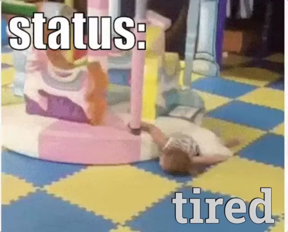 a picture of a child laying on the floor with the words " status : tired " below it