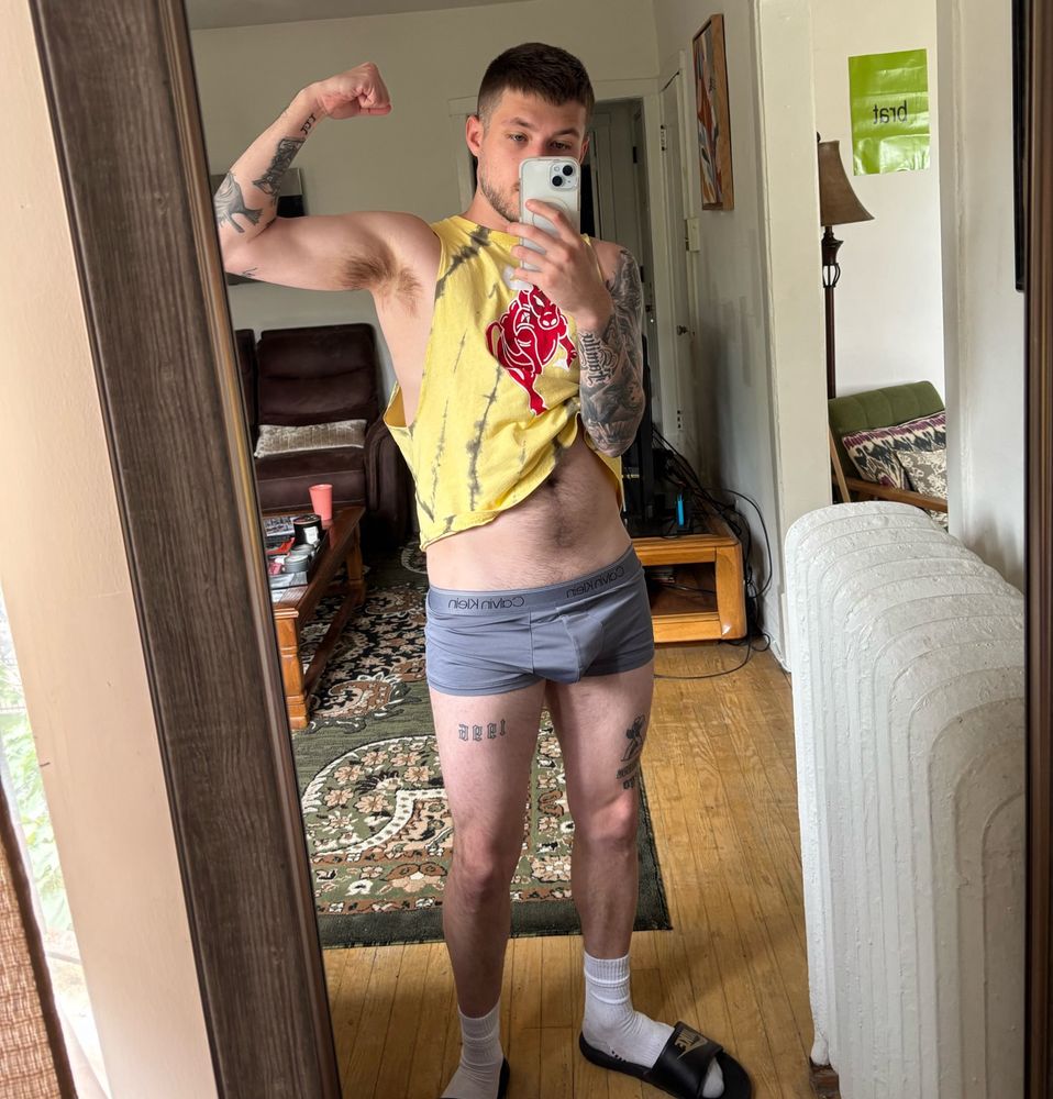 gay guy flexing