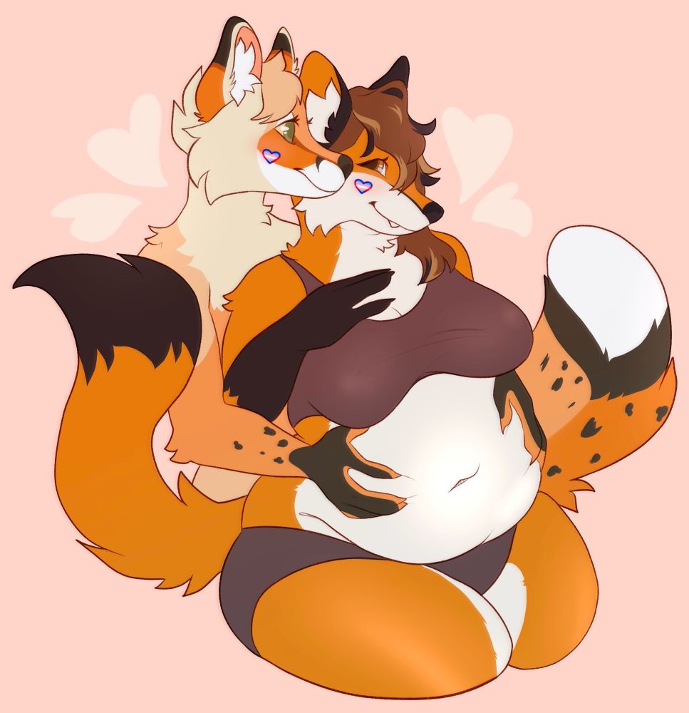 Two furry characters with trans coloured hearts on their cheek. The peach/beige coloured character rubs the chubby fox character's pudgy belly from behind, as the two smile at one another.