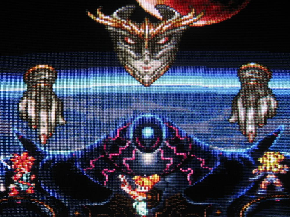 Crono, Marle and Ayla face down Queen Zeal atop the Black Omen in the stratosphere.