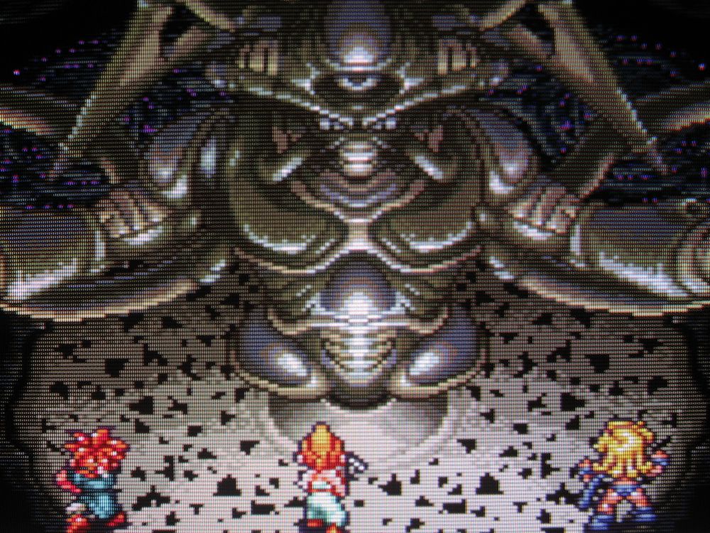 After questing through every epoch and uniting humanity across the ages, our millennial heroes finally strike at the heart of the world-devouring alien parasite Lavos.