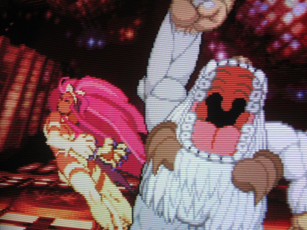 In a futuristic cyberscape, Sasquatch (a yeti) uppercuts cat lady Felicia with his boulder-sized paw. Roaring with mouth gaped like a hippopotamus his inky abyss of a throat displays a massive uvula. You could work that thing like a speed bag.