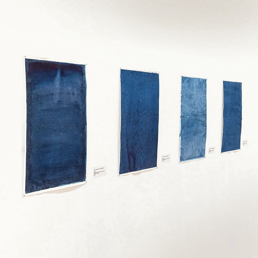 4 blue drawings on gallery wall
