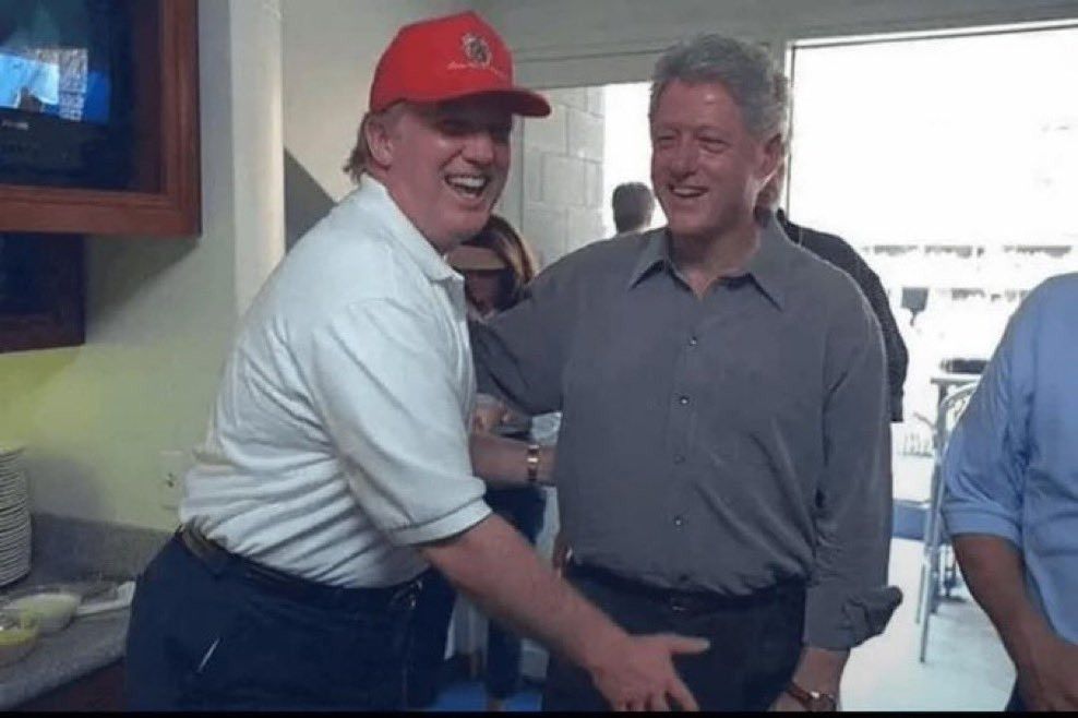 Donald Trump attempting to grab Bill Clinton's  junk