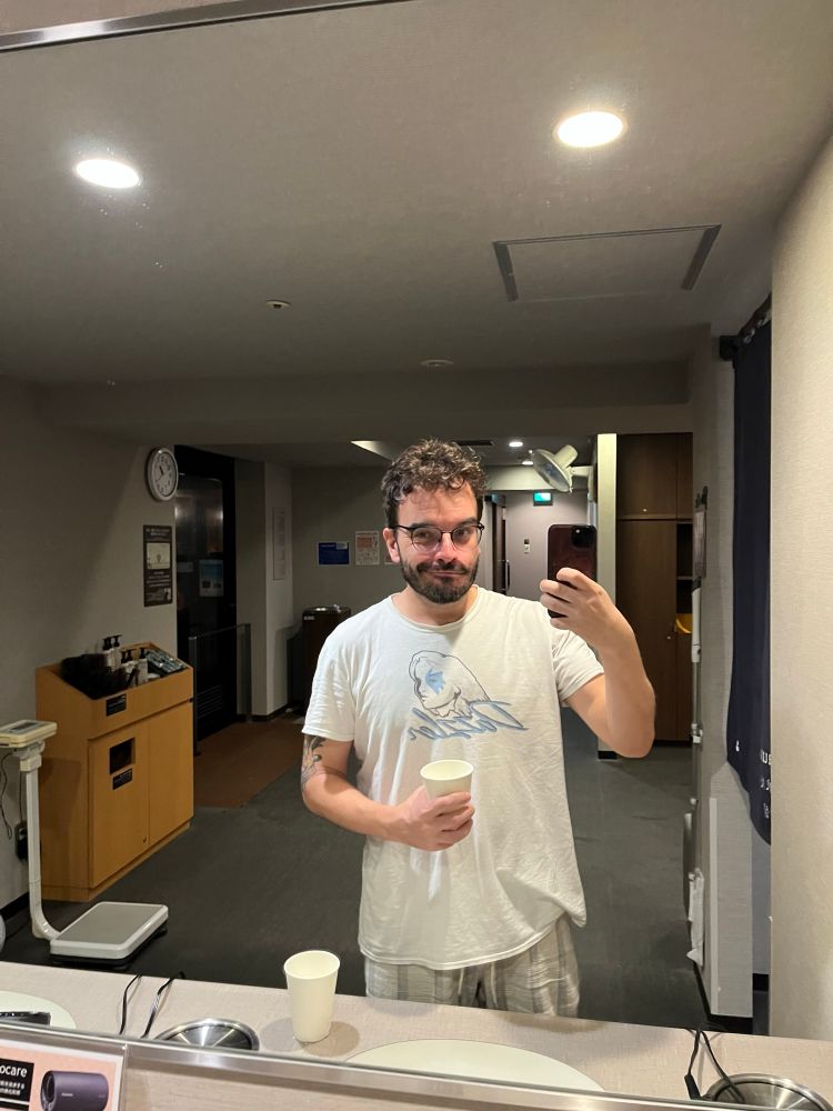 Oliveira holding his glass of water