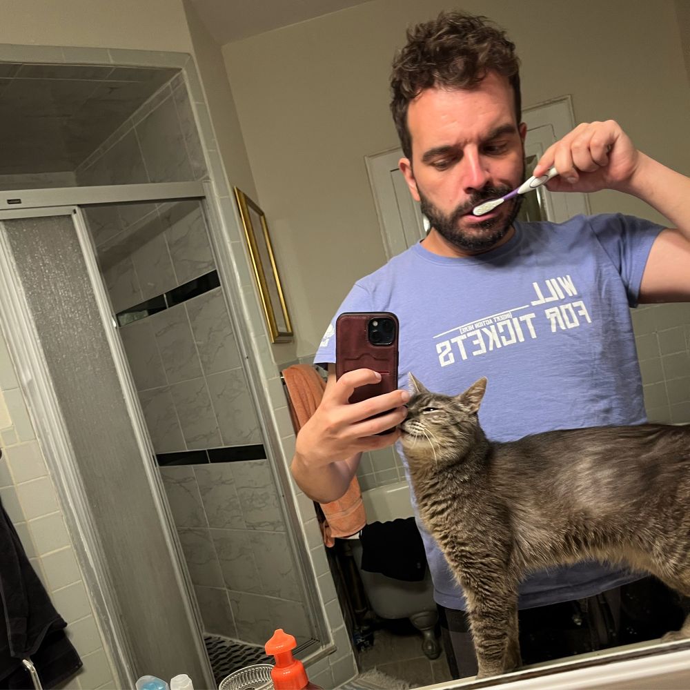 oliveira brushing teeth, with cat 