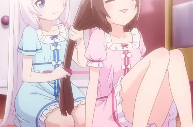 two anime girls are brushing each other 's hair and one has a k on her shirt