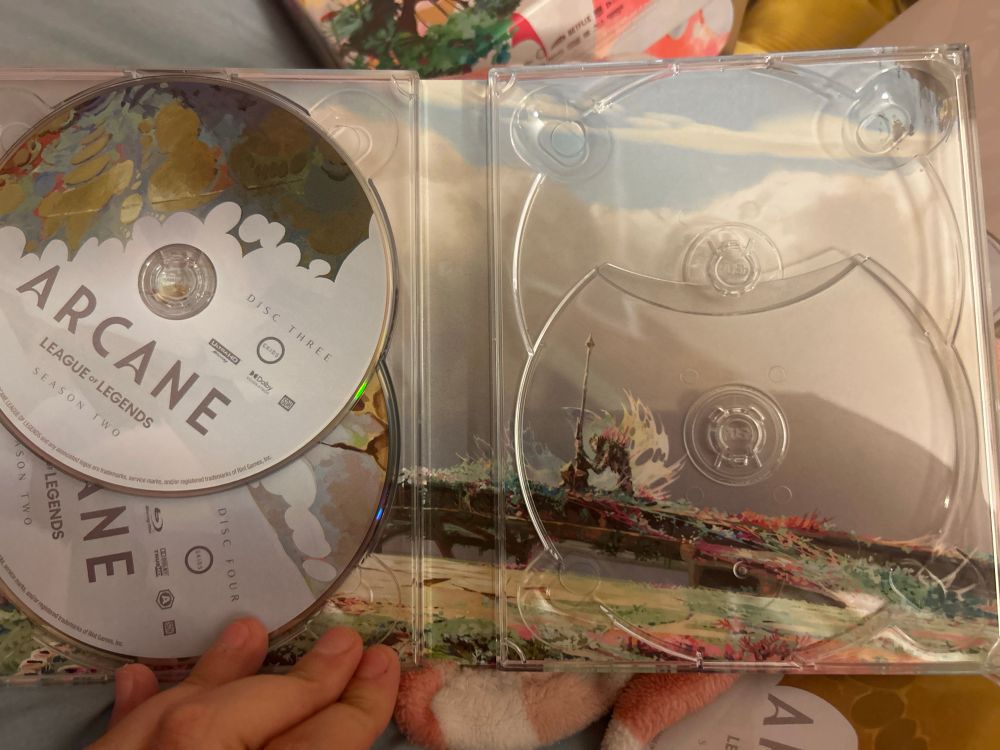 Finally: the dvds themselves. The statue of Jayce is in the back design of the dvd case, alone in a field