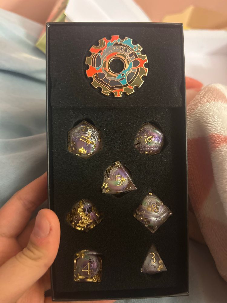 Inside the black box is the now infamous hexcorized Jayvik cog and hexcore-style D20s 