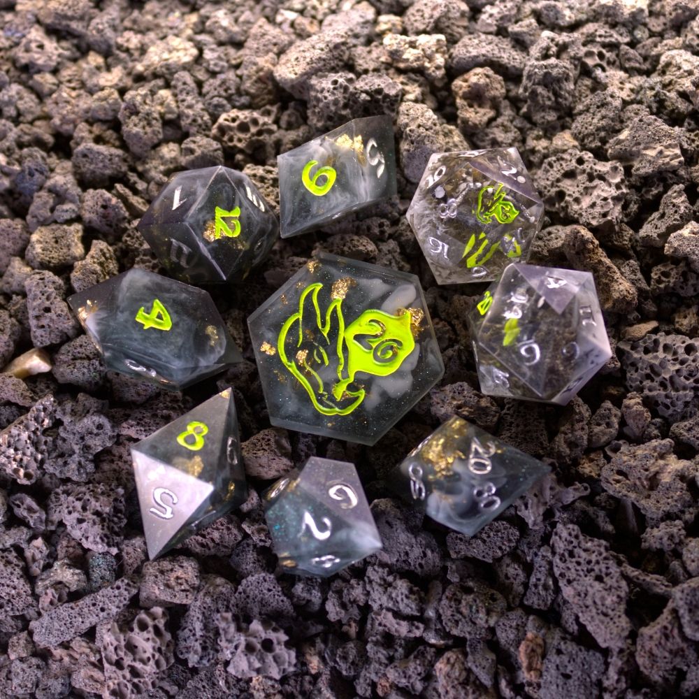 Rogue Dice Set. Tinted black with smokey effect, gold foil, and slight green interference powder.