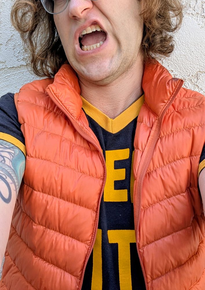 The obscured shirt says STEEL CITY