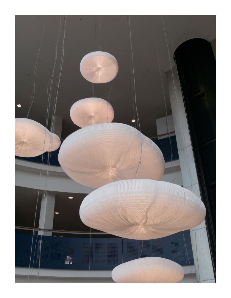 Wispy, cloud-like lamps suspended from the ceiling.