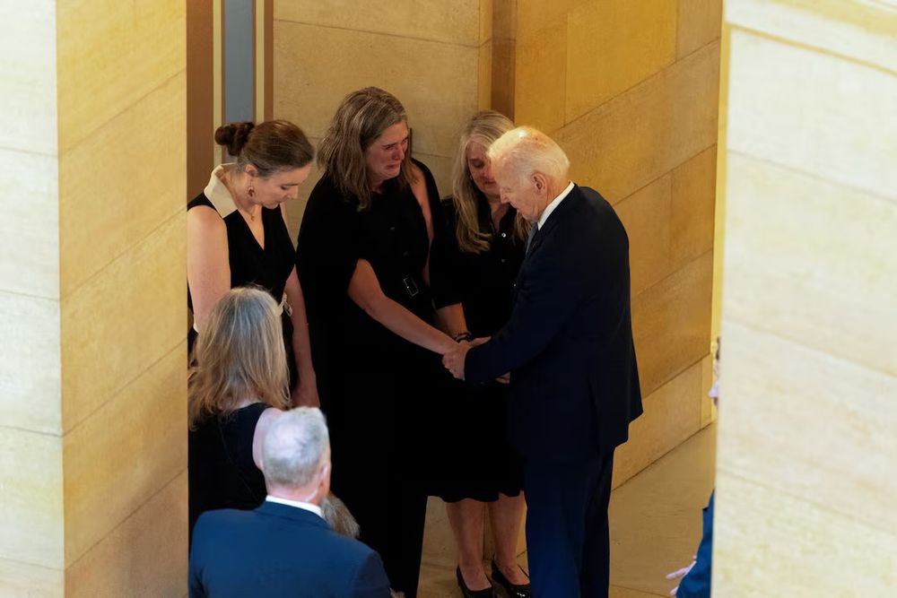 President Biden visiting with grieving member of Melissa Hortman’s family.