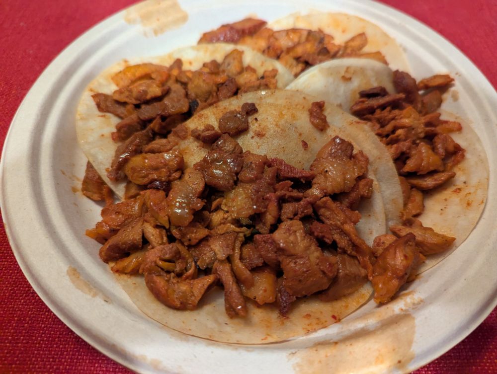 A plate of tacos al pastor