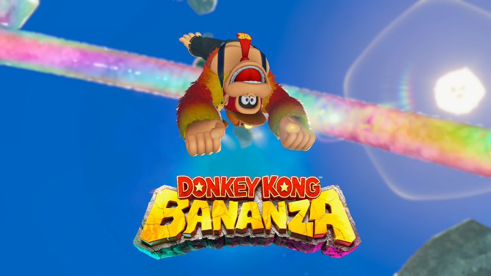 Screenshot of Donkey Kong Bananza with Donkey Kong flipped upside down, mid-air, with a rainbow bridge and the sun shining behind him, and the logo of the game under him