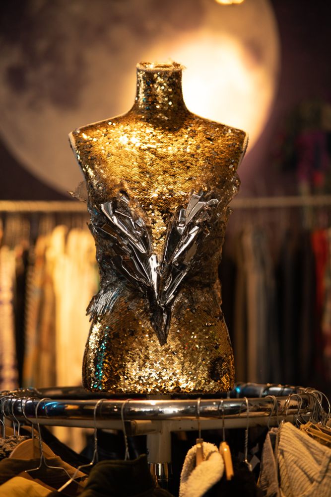 Mirror corset placed on a puppet.