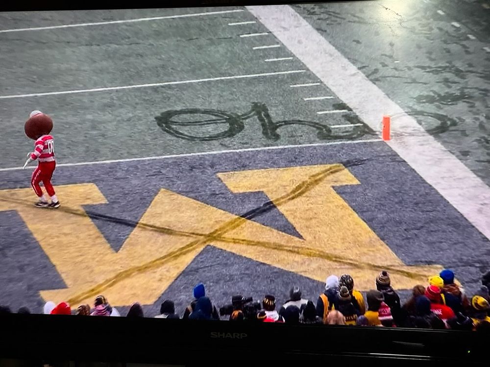 Brutus the Buckeye, Ohio State’s mascot, made an X in the snow over the M in Michigan in the end zone and wrote Script Ohio beside it! 