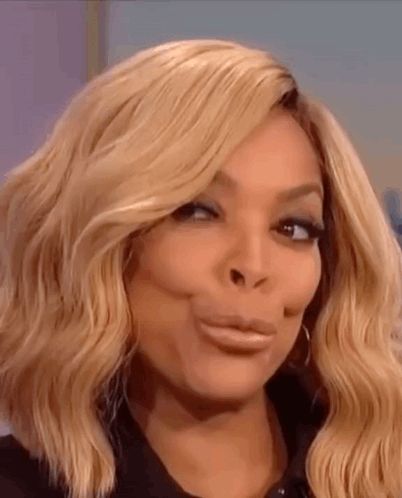 wendy williams is making a funny face with her mouth open .