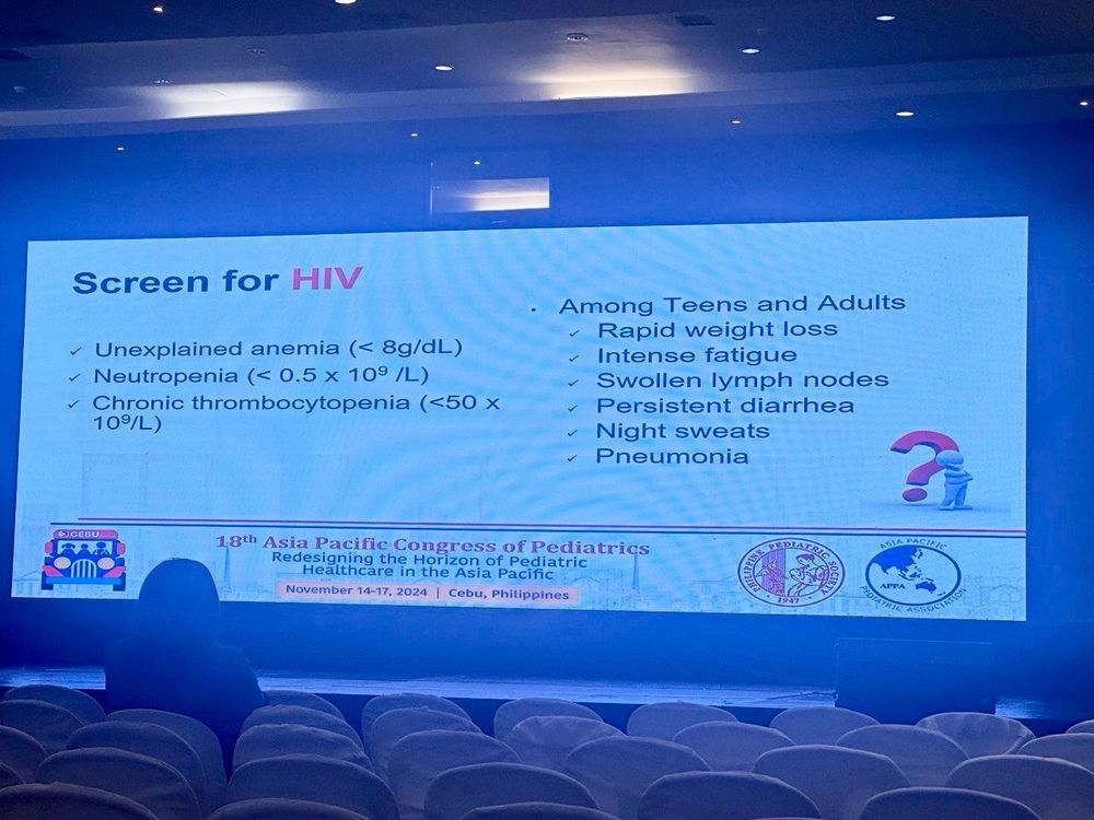 Picture of a conference slide providing a list of when to screen for HIV in teens