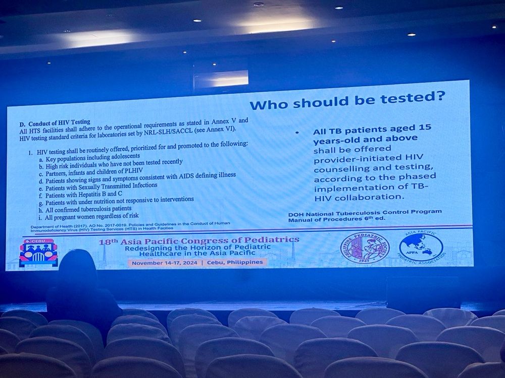 Picture of a conference slide providing a list of when to screen for HIV in teens