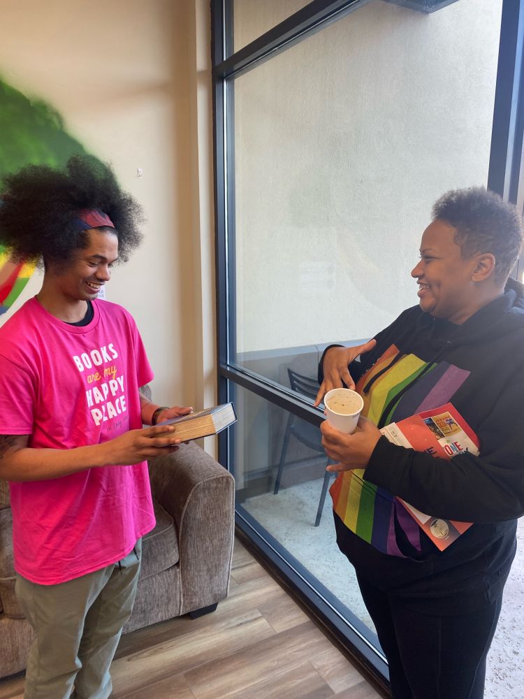 Meeting Mychal Threets, librarian, and gifting a copy of Fire In The Library board game.